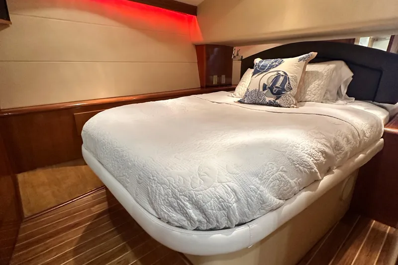 Slide: The Image of Luxurious bedroom interior of 2002 Hatteras 50 Convertible Sportfish yacht with elegant bedding. - 89