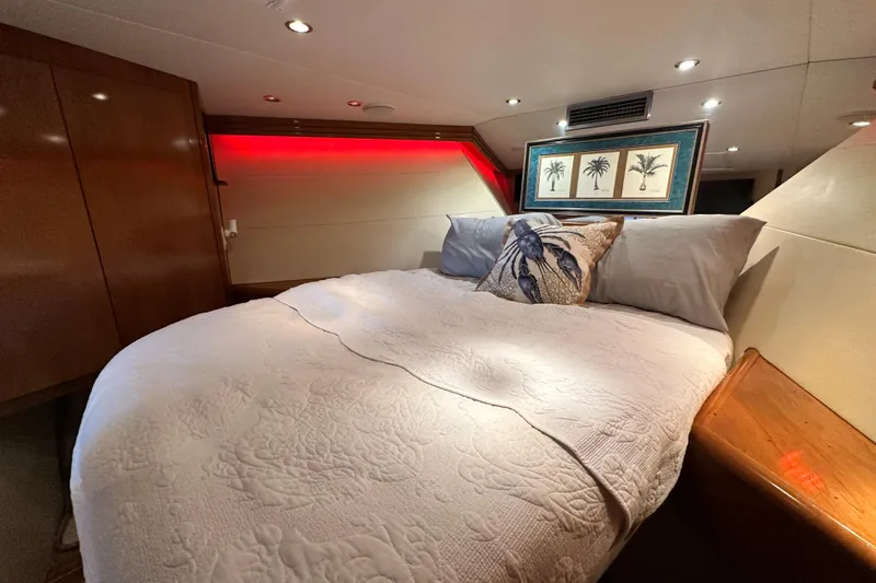 Slide: The Image of Luxurious bedroom interior of 2002 Hatteras 50 Convertible Sportfish yacht with elegant decor. - 90