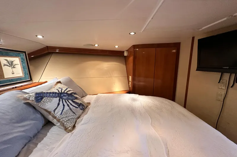 Slide: The Image of Luxurious bedroom interior of 2002 Hatteras 50 Convertible Sportfish yacht. - 92