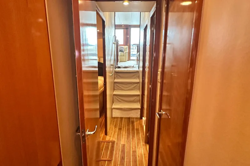 Slide: The Image of Interior hallway of 2002 Hatteras 50 Convertible Sportfish yacht with wooden flooring. - 94