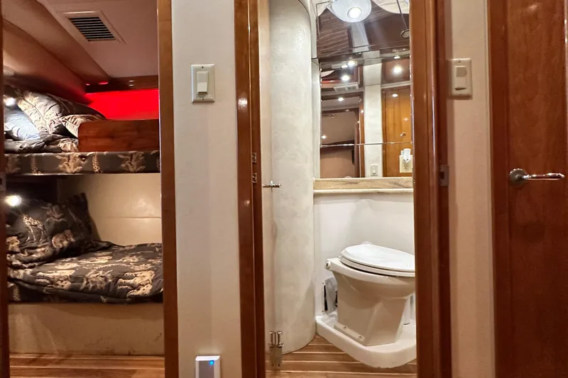 Slide: The Image of Interior of 2002 Hatteras 50 Convertible Sportfish with bunk beds and bathroom. - 95