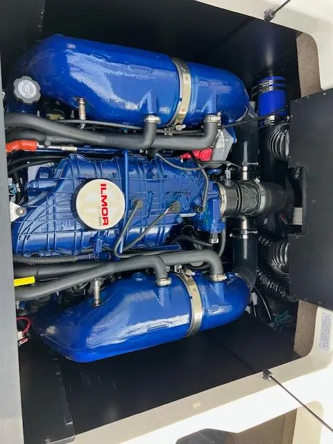 Slide: The Image of 2025 MasterCraft NXT23 engine compartment featuring a powerful Ilmor engine. - 19