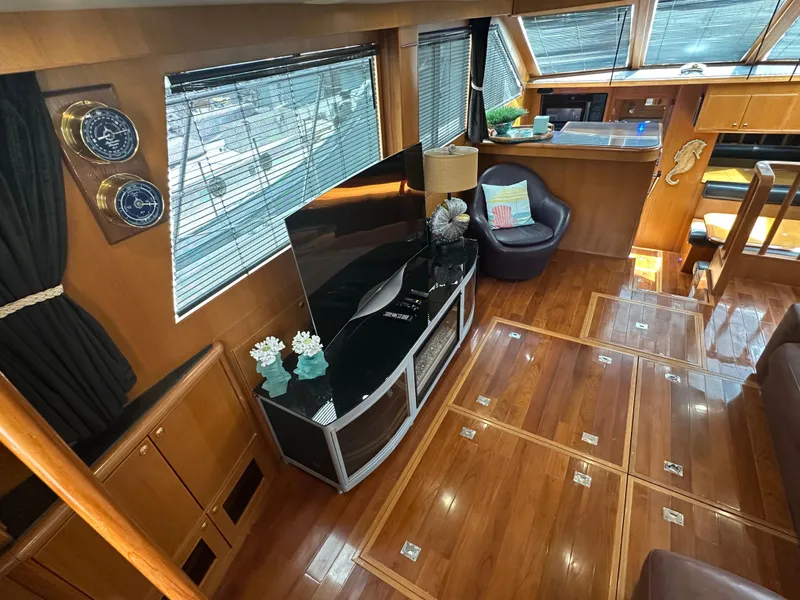 Slide: The Image of Luxurious interior of 2005 Jefferson Rivanna 50 SDMY yacht with polished wood flooring. - 12