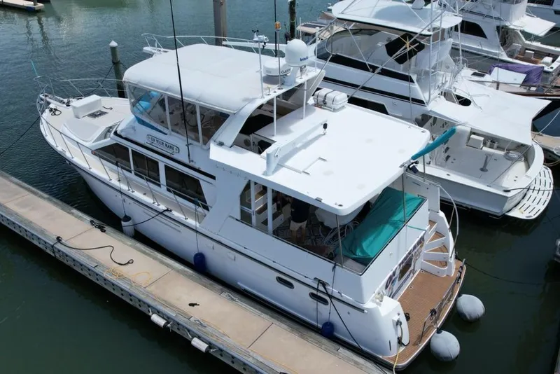 Slide: The Image of 2005 Jefferson Rivanna 50 SDMY yacht docked at marina, aerial view. - 2