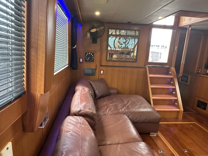 Slide: The Image of Luxurious interior of 2005 Jefferson Rivanna 50 SDMY yacht with leather seating and wooden accents. - 20