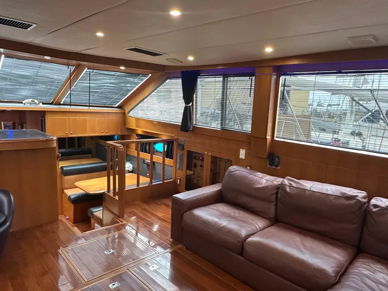 Slide: The Image of Luxurious interior of 2005 Jefferson Rivanna 50 SDMY yacht with leather sofa and dining area. - 22