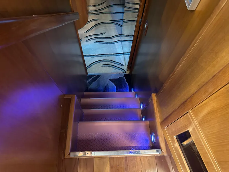 Slide: The Image of Staircase with blue LED lights on a 2005 Jefferson Rivanna 50 SDMY yacht. - 26