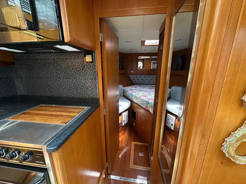 Slide: The Image of Interior of 2005 Jefferson Rivanna 50 SDMY yacht with kitchen and cozy bedroom. - 42