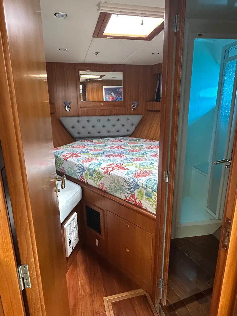 Slide: The Image of 2005 Jefferson Rivanna 50 SDMY cabin with colorful bedding and wooden interior. - 43