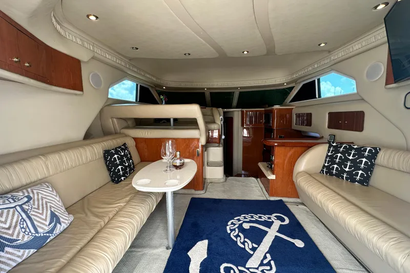 Slide: The Image of Luxurious interior of a 2001 Sea Ray 400 Sedan Bridge yacht with elegant seating and decor. - 13