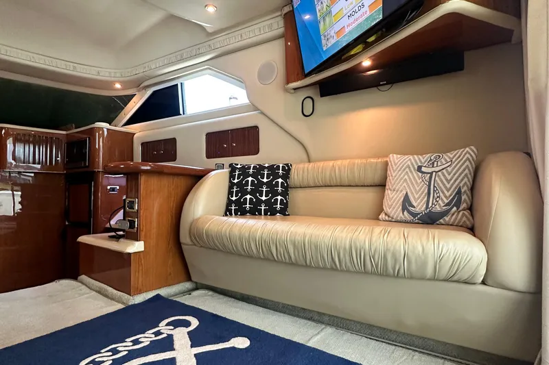 Slide: The Image of Luxurious interior of 2001 Sea Ray 400 Sedan Bridge with nautical-themed decor and modern amenities. - 17