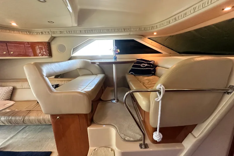 Slide: The Image of Luxurious interior of 2001 Sea Ray 400 Sedan Bridge yacht with plush seating and elegant decor. - 23
