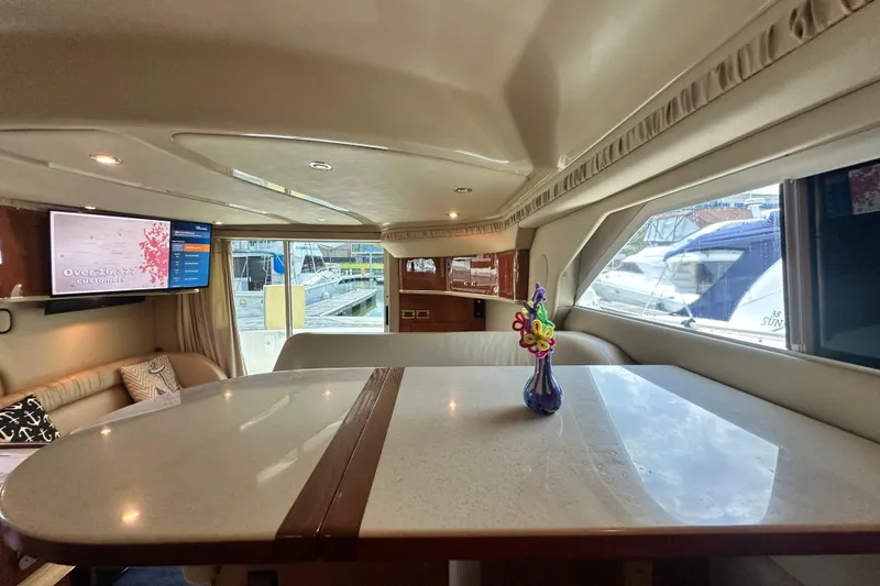 Slide: The Image of Interior of 2001 Sea Ray 400 Sedan Bridge yacht with elegant seating and decor. - 25