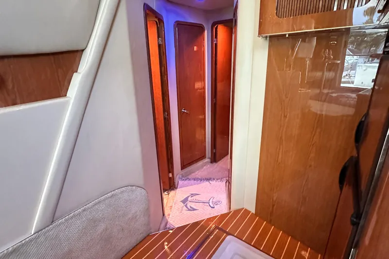 Slide: The Image of Interior hallway of 2001 Sea Ray 400 Sedan Bridge yacht with wooden finishes. - 30