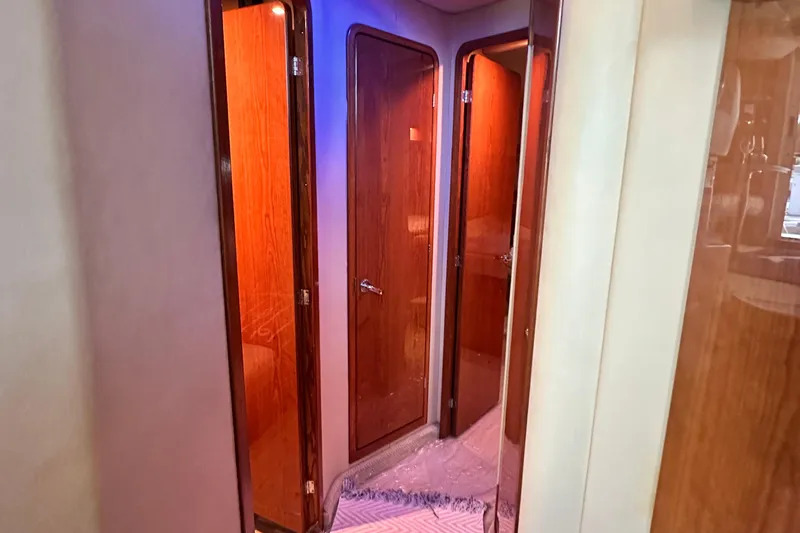 Slide: The Image of Interior hallway of 2001 Sea Ray 400 Sedan Bridge with wooden doors. - 34