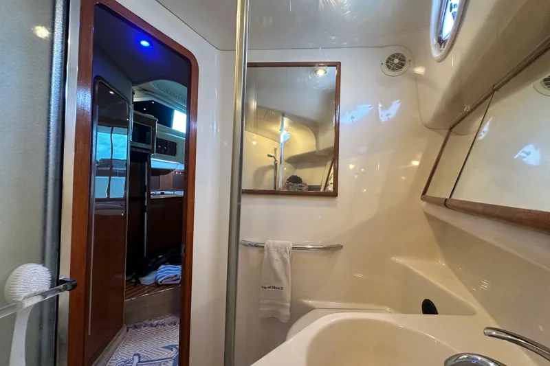 Slide: The Image of Interior of 2001 Sea Ray 400 Sedan Bridge yacht bathroom with mirror and sink. - 46