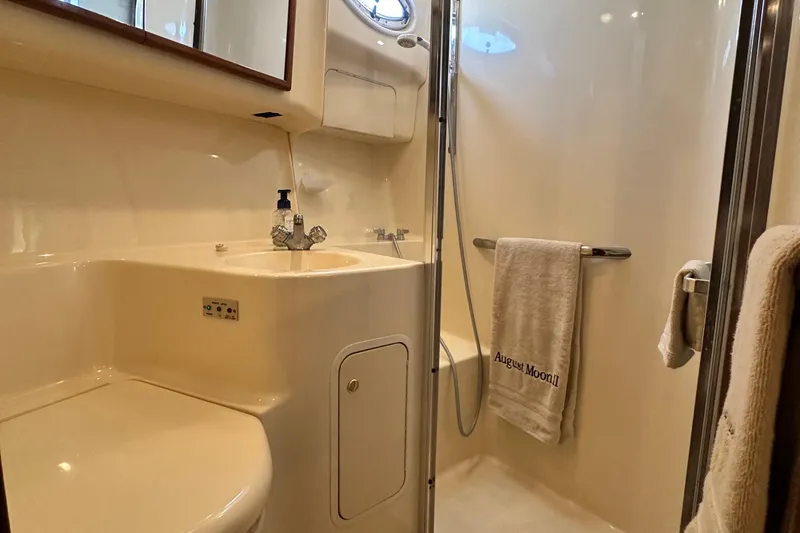 Slide: The Image of Bathroom interior of 2001 Sea Ray 400 Sedan Bridge yacht, featuring shower and sink. - 52