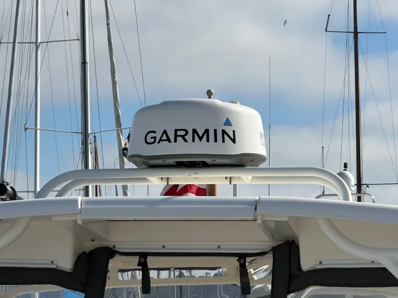 Slide: The Image of 2018 Wellcraft 290 Coastal boat with Garmin radar system, docked among sailboats. - 41