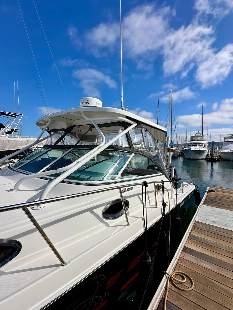 Slide: The Image of 2018 Wellcraft 290 Coastal boat docked at marina under clear blue sky. - 5