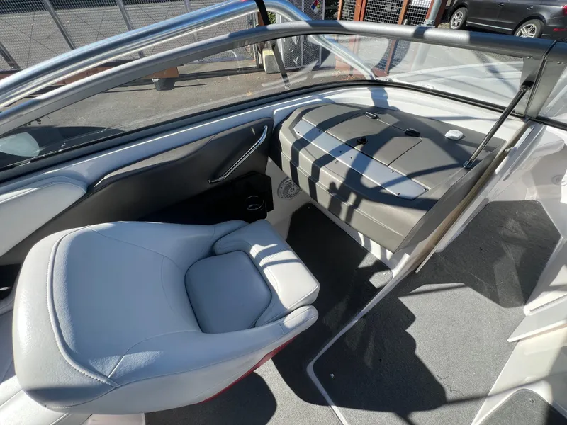 Slide: The Image of Interior of a 2007 Regal 2000 boat, featuring sleek seating and modern design. - 13