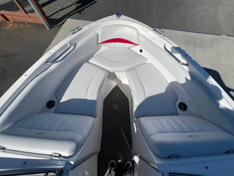 Slide: The Image of Bow seating area of a 2007 Regal 2000 boat with white upholstery. - 17