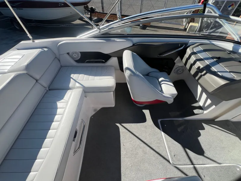Slide: The Image of Interior of a 2007 Regal 2000 boat with gray seating and carpet. - 9