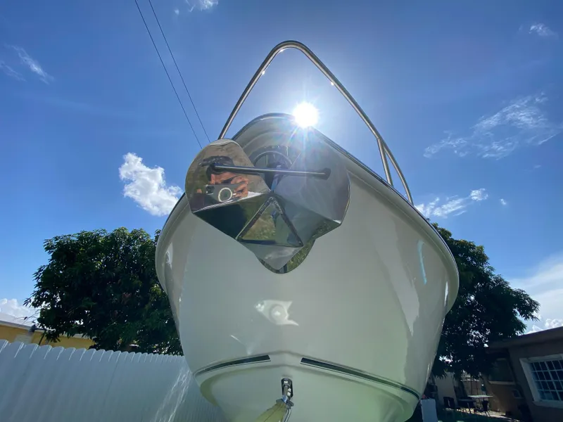 Slide: The Image of 2007 Boston Whaler 320 Outrage Cuddy Cabin under bright blue sky. - 15
