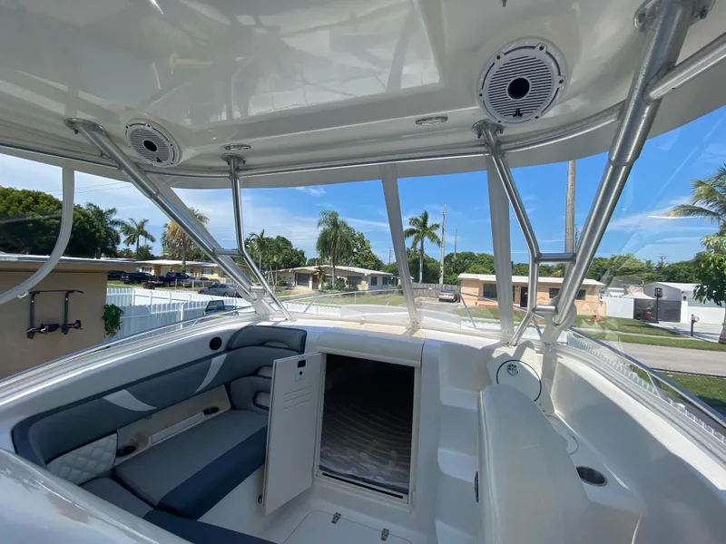 Slide: The Image of 2007 Boston Whaler 320 Outrage Cuddy Cabin interior with seating and open hatch. - 26