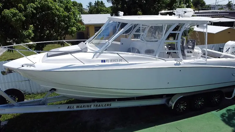Slide: The Image of 2007 Boston Whaler 320 Outrage Cuddy Cabin on trailer, side view. - 3