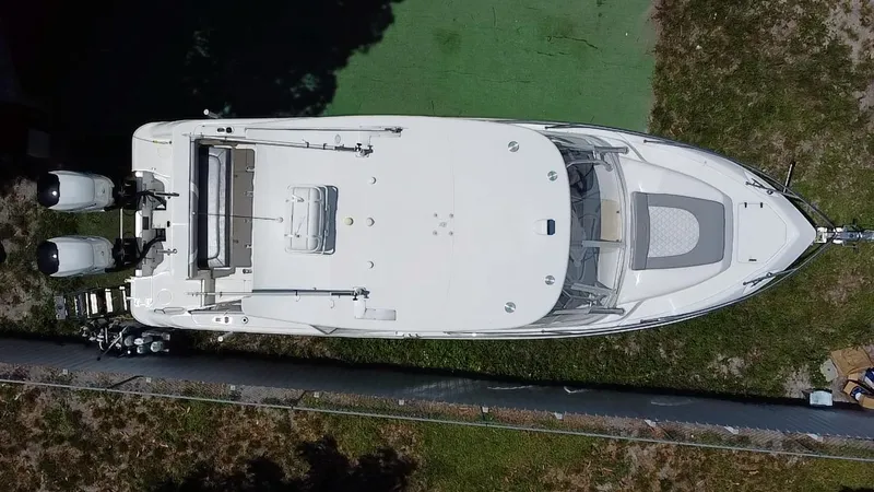 Slide: The Image of Aerial view of 2007 Boston Whaler 320 Outrage Cuddy Cabin boat on grass. - 31