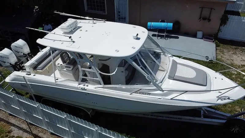 Slide: The Image of 2007 Boston Whaler 320 Outrage Cuddy Cabin boat on trailer, viewed from above. - 7