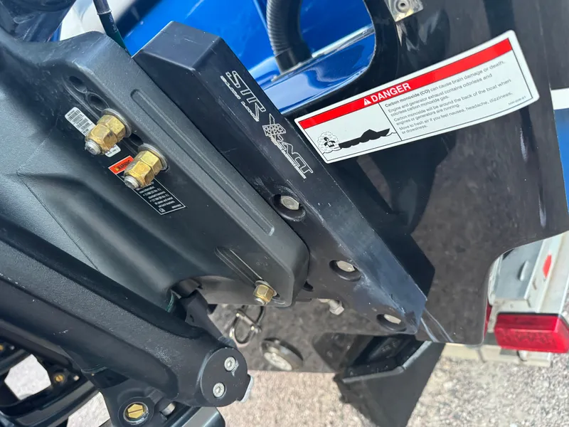 Slide: The Image of Close-up of 2023 Fountain 38 SC boat engine components with warning label. - 10