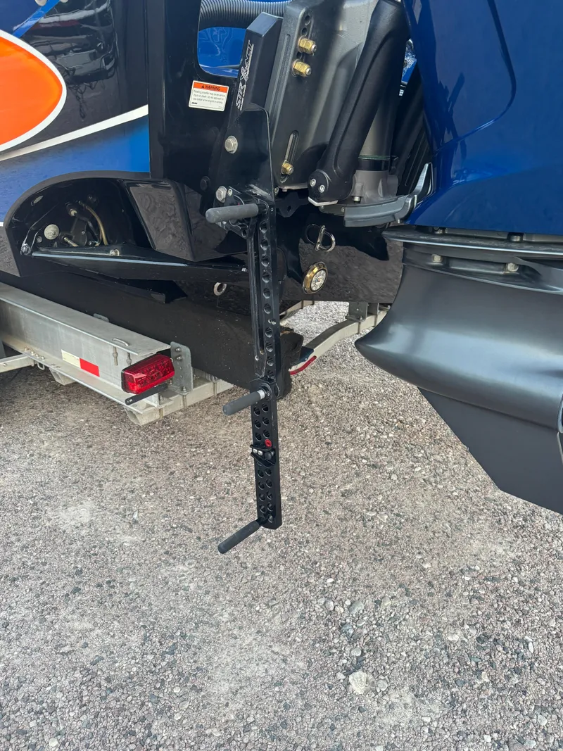 Slide: The Image of 2023 Fountain 38 SC boat trailer hitch detail on gravel surface. - 12
