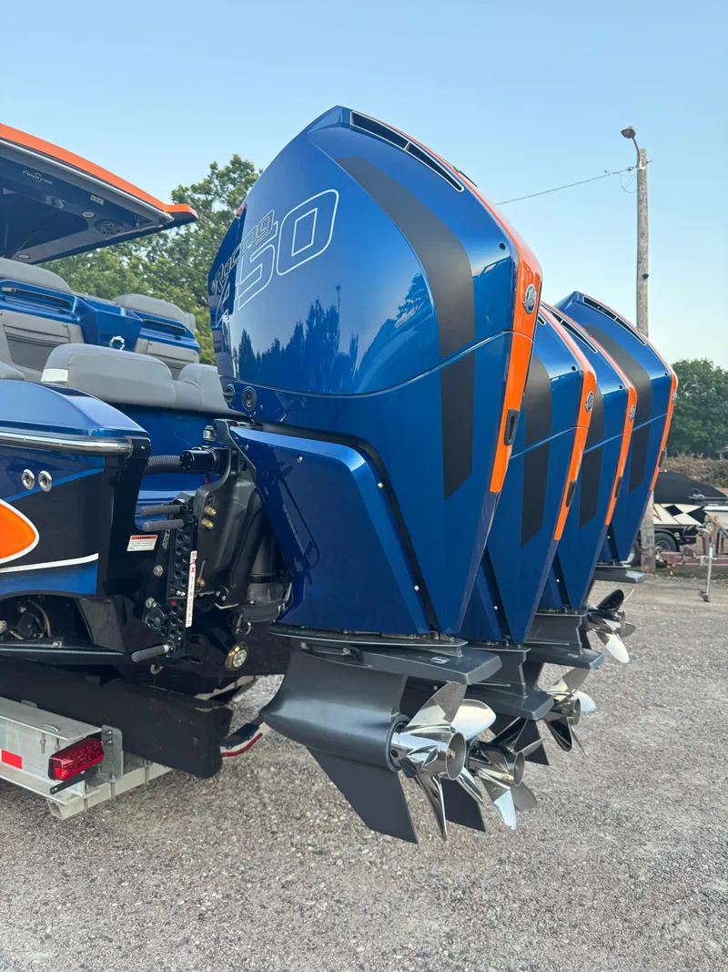 Slide: The Image of 2023 Fountain 38 SC boat with powerful blue outboard engines. - 13