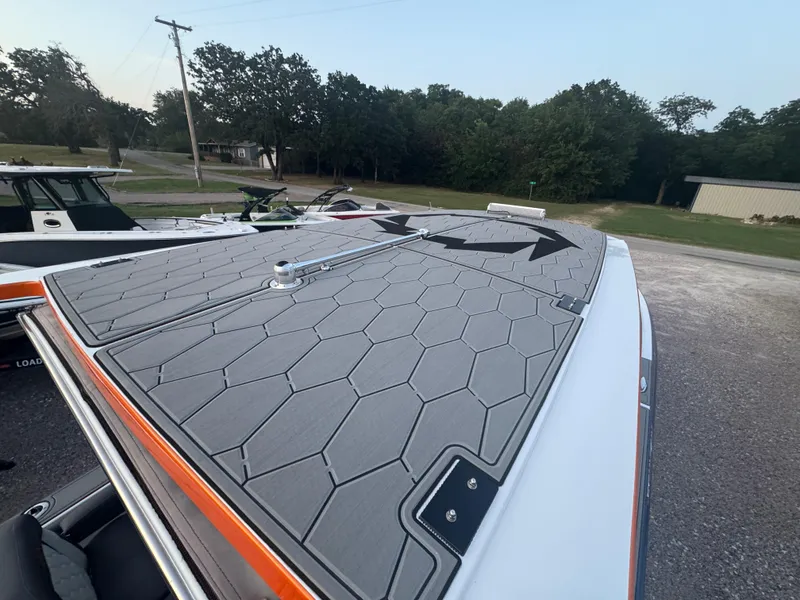 Slide: The Image of 2023 Fountain 38 SC boat deck with hexagonal pattern and arrow design. - 20