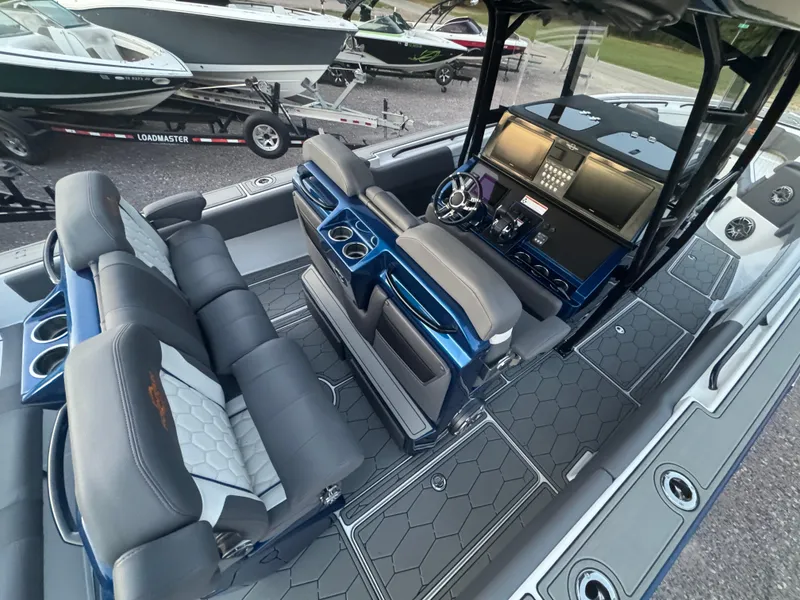 Slide: The Image of 2023 Fountain 38 SC boat interior with modern seating and control panel. - 21