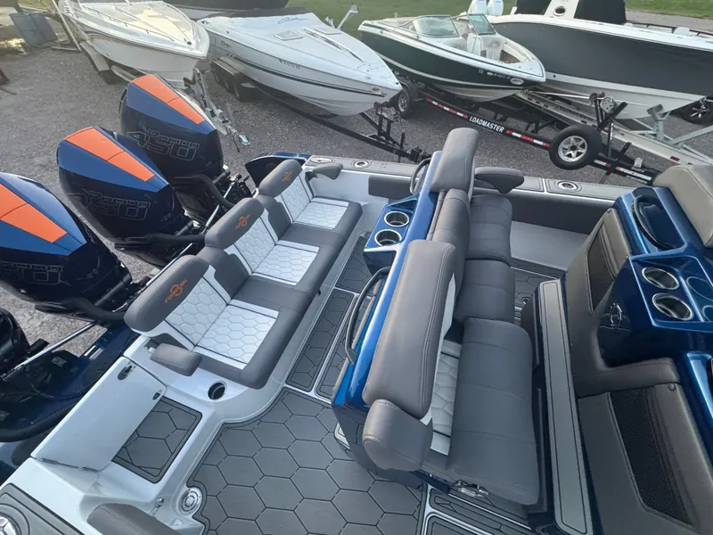 Slide: The Image of 2023 Fountain 38 SC boat interior with seating and powerful outboard engines. - 22