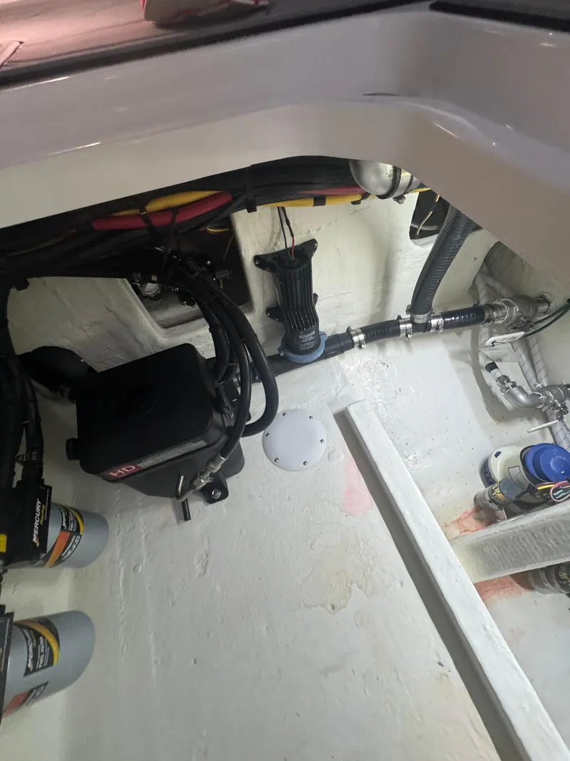 Slide: The Image of Engine compartment of 2023 Fountain 38 SC boat, showing wiring and components. - 28