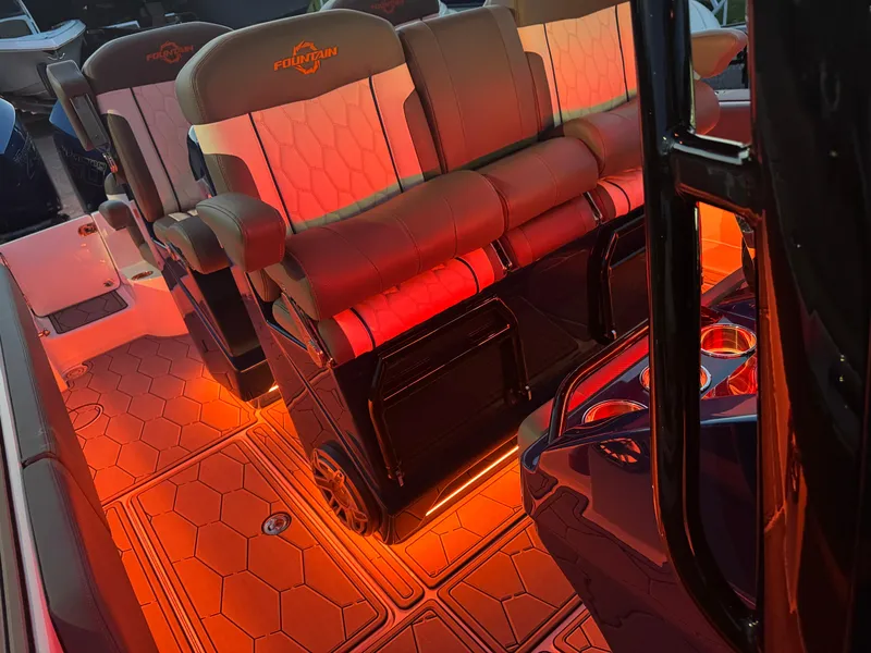 Slide: The Image of 2023 Fountain 38 SC boat interior with illuminated seating and flooring. - 3