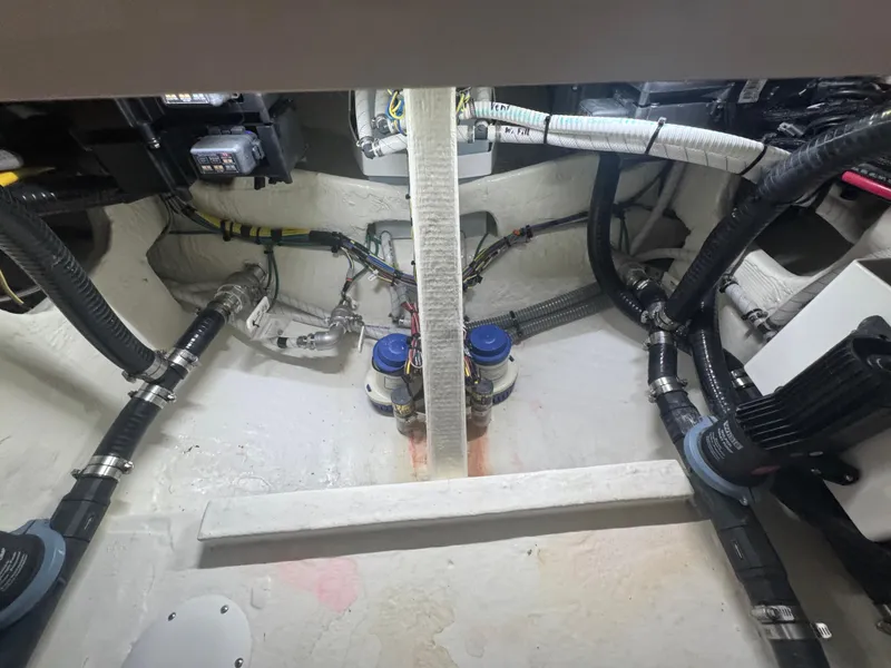 Slide: The Image of Engine compartment of 2023 Fountain 38 SC boat, showcasing wiring and components. - 33