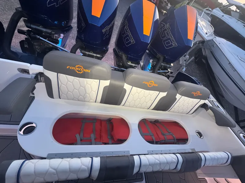 Slide: The Image of 2023 Fountain 38 SC boat with triple outboard engines and stylish seating. - 35