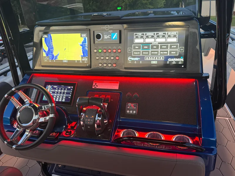 Slide: The Image of 2023 Fountain 38 SC boat dashboard with advanced navigation and control systems. - 42