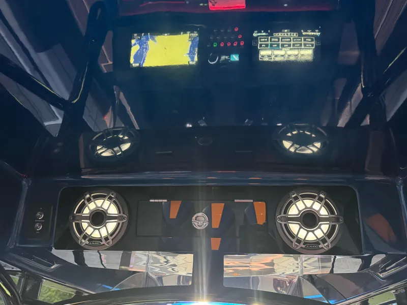 Slide: The Image of Control panel of 2023 Fountain 38 SC boat with speakers and navigation display. - 44