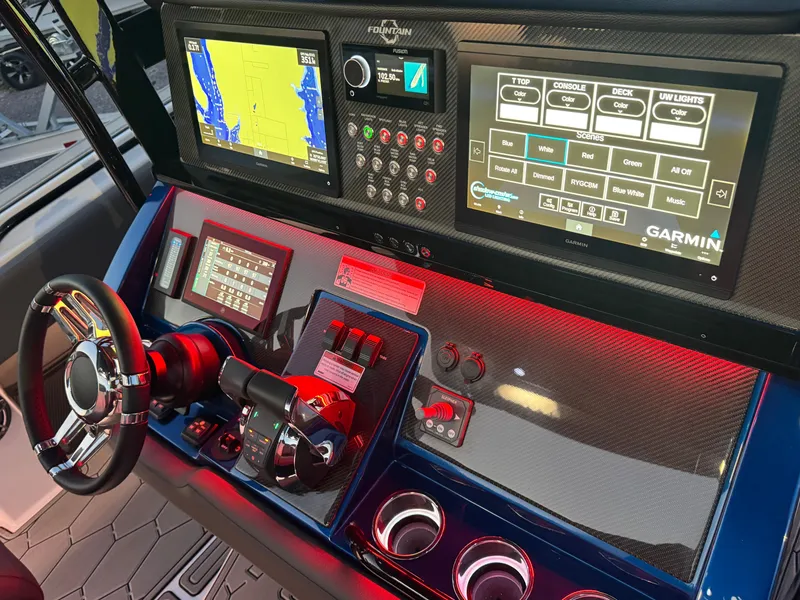 Slide: The Image of 2023 Fountain 38 SC boat dashboard with Garmin navigation and control systems. - 45