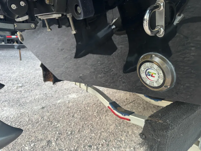 Slide: The Image of 2023 Fountain 38 SC boat detail showing rear hardware and logo on a trailer. - 9