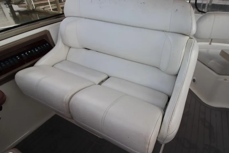 Slide: The Image of White leather seating on 2004 Regal Commodore 3860 boat, showcasing luxury interior design. - 11