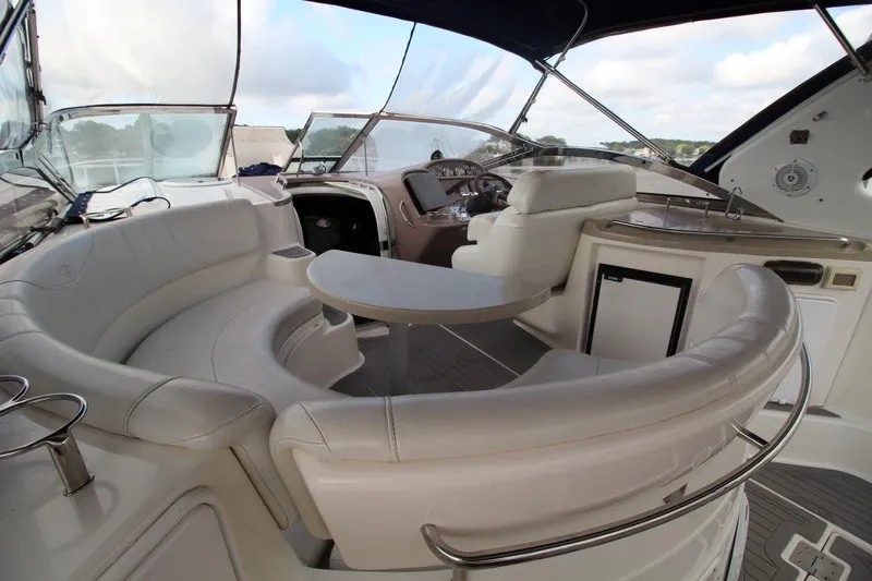 Slide: The Image of Luxurious interior of 2004 Regal Commodore 3860 yacht with plush seating and helm. - 9