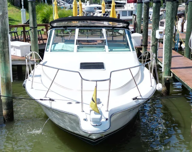 Slide: The Image of 2001 Tiara Yachts 2900 Open docked at marina, front view. - 4