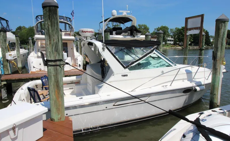Slide: The Image of 2001 Tiara Yachts 2900 Open docked at a marina on a sunny day. - 5