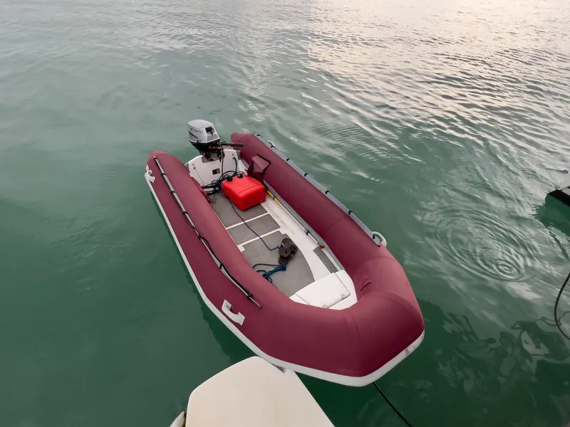 Slide: The Image of Red inflatable boat with motor on calm water, Antares PDQ 44, 2005 model. - 13